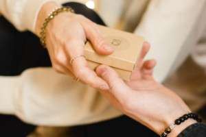 image of two hands holding a gift card